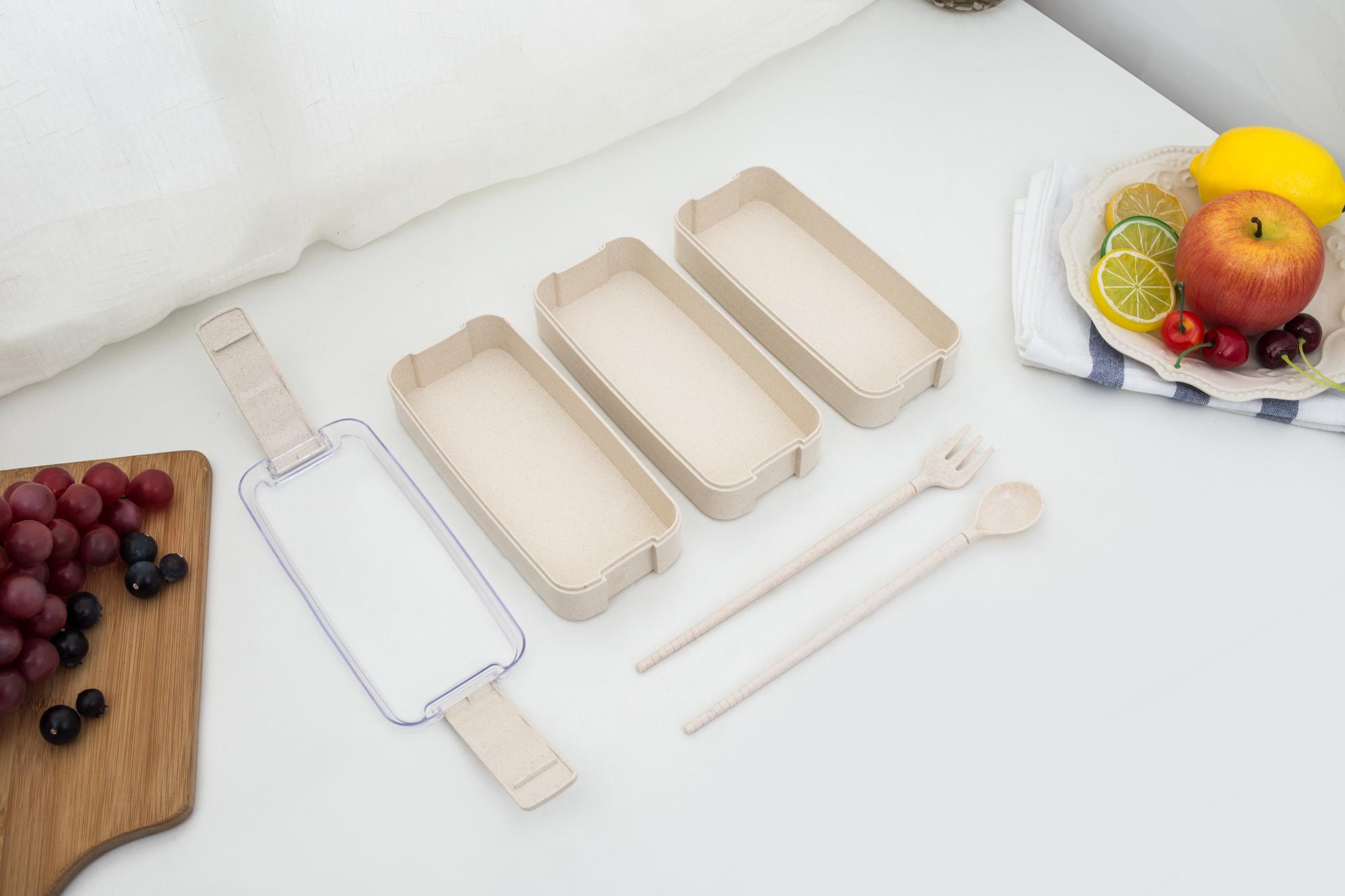 Neatly arranged ingredients in reusable packaging on a white table